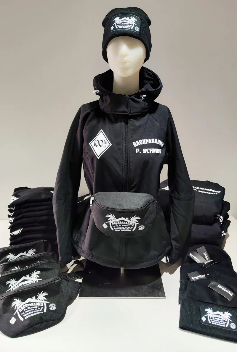 Dachparadies P. Schmidt Softshelljacke, Mütze und Gürteltaschen in Schwarz